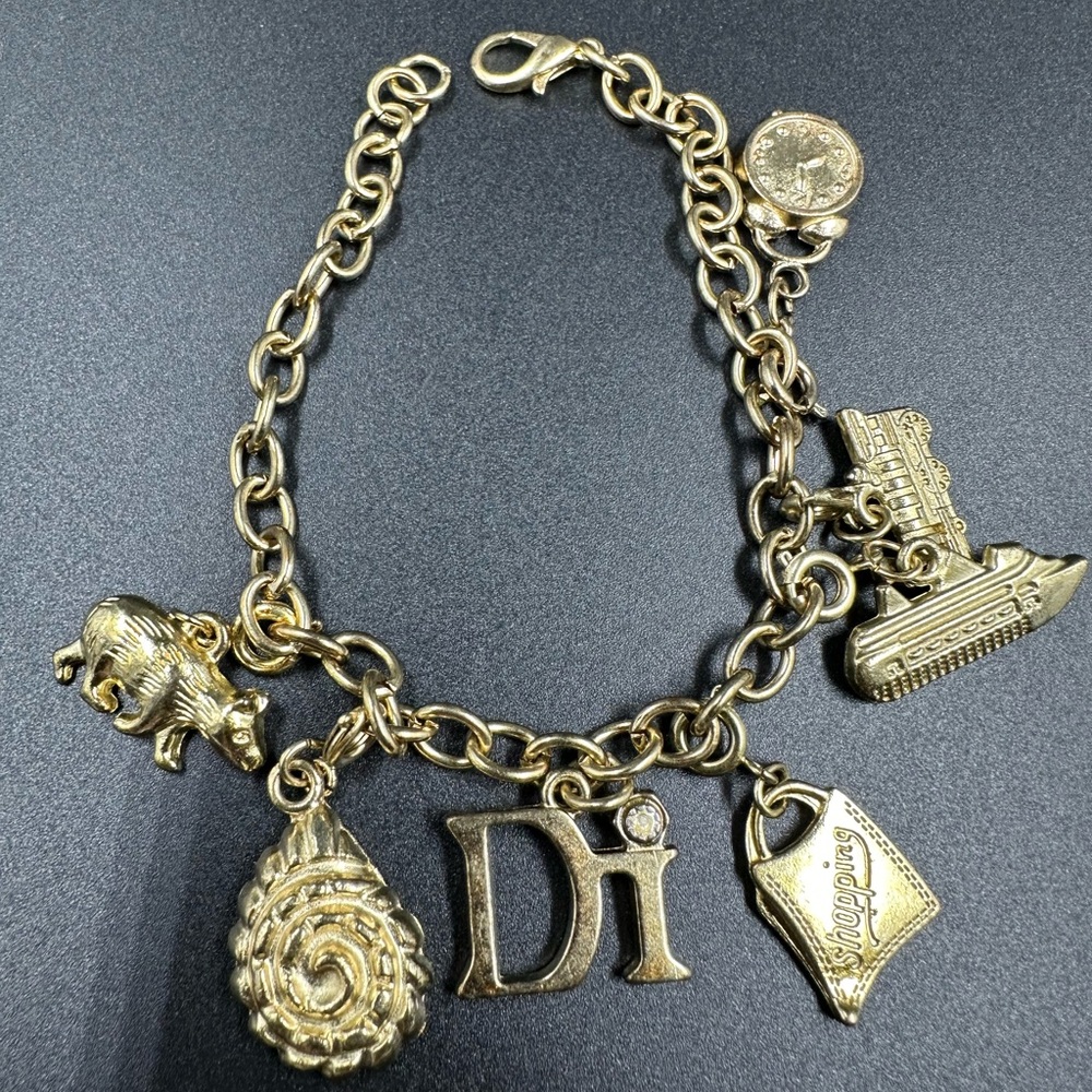 Diamond International DI Gold Tone Charm Bracelet Ship Clock Bear Train Rope